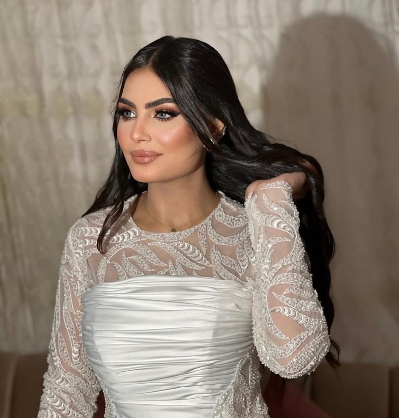 Arabic bride portrait for Sharjah wedding with traditional Arabic bridal makeup and hair by Elani Artistry, full bridal look with gold jewellery and dramatic eye work