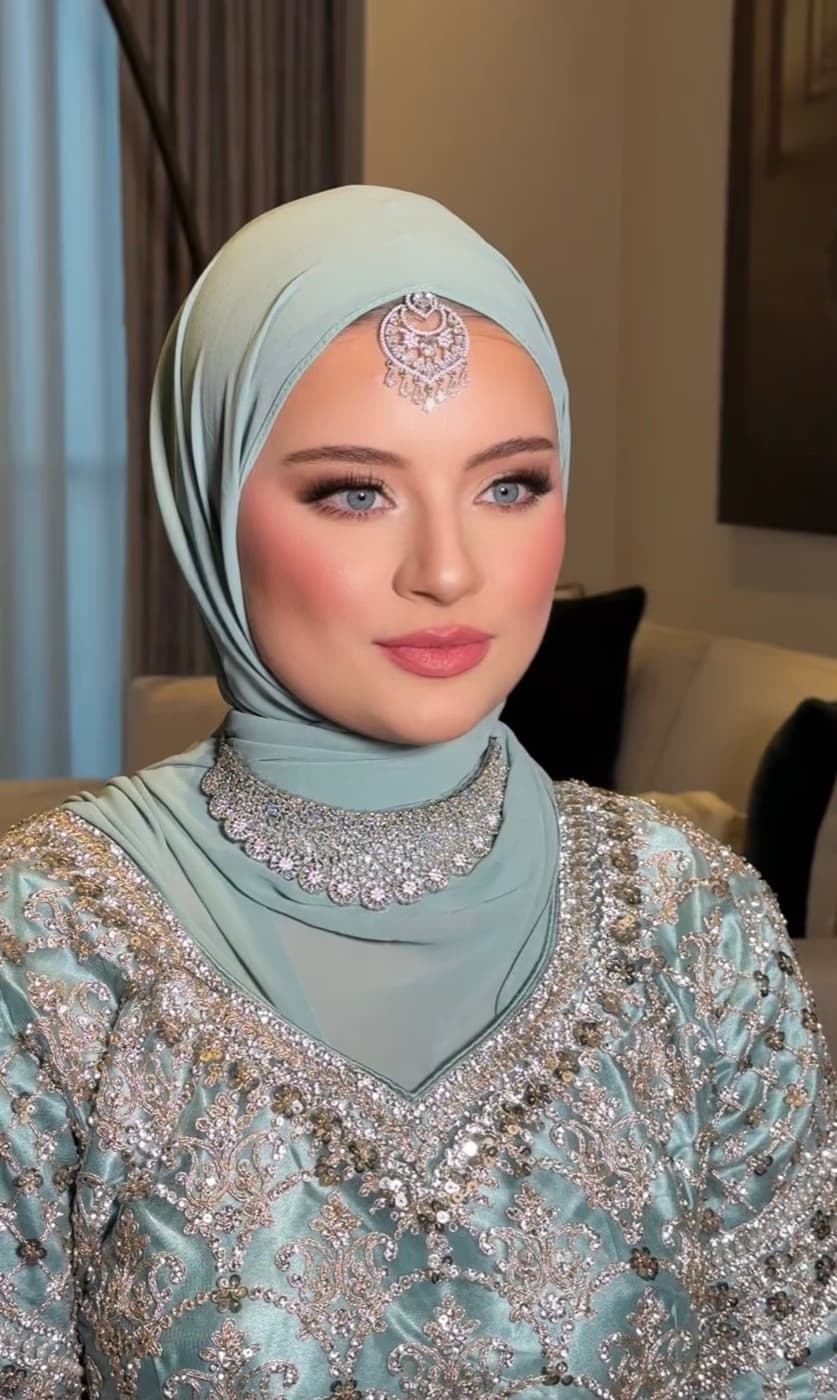 Western Muslim bride in Sharjah with contemporary modest bridal makeup natural refined skin soft eye and elegant finish by Elani Artistry