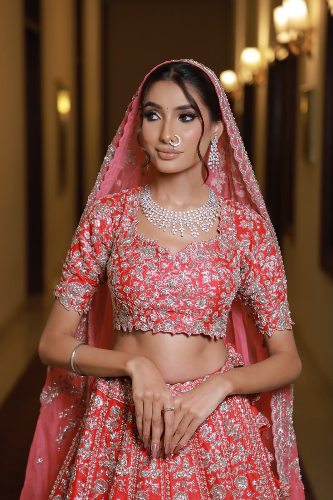 Sindhi Hindu bride in Abu Dhabi with rich traditional bridal makeup jewel-toned lehenga palette bold eye defined features and statement finish by Elani Artistry