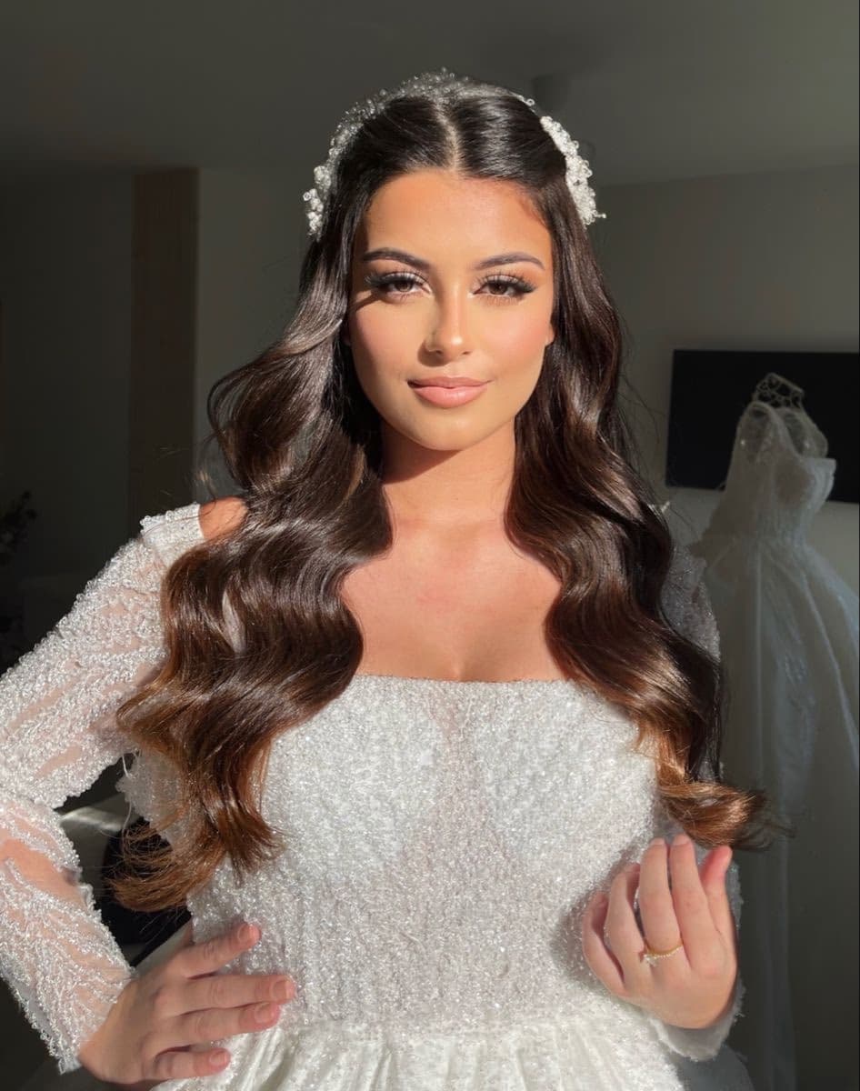 Arabic Muslim bride in Sharjah with rich smoky eye elegant Arabic bridal makeup gold tones and defined brow by Elani Artistry