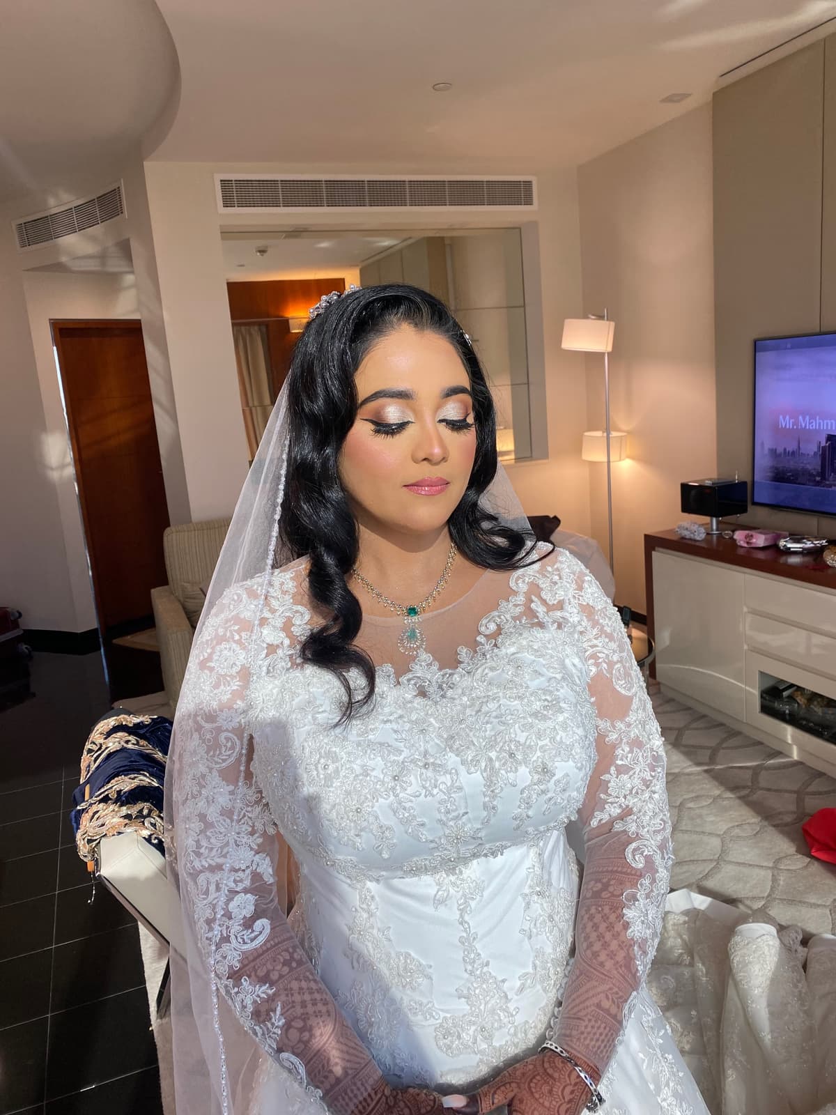 South Asian Muslim bride in Sharjah with rich warm bridal makeup deep jewel tones traditional lehenga palette and full bridal finish by Elani Artistry