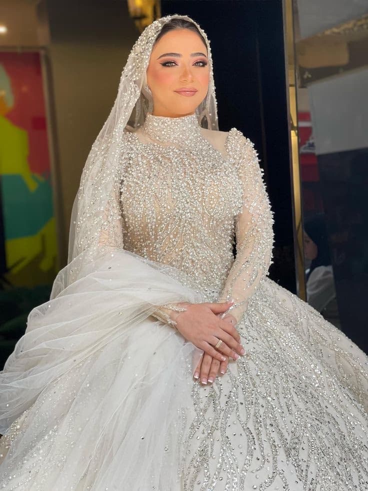Turkish Muslim bride in Sharjah with polished elegant bridal makeup cool-toned refined skin berry lip and structured eye by Elani Artistry