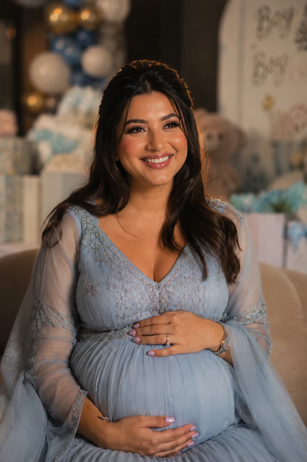 Baby shower makeup by Elani Artistry Dubai, mom-to-be in blue gown at baby shower celebration