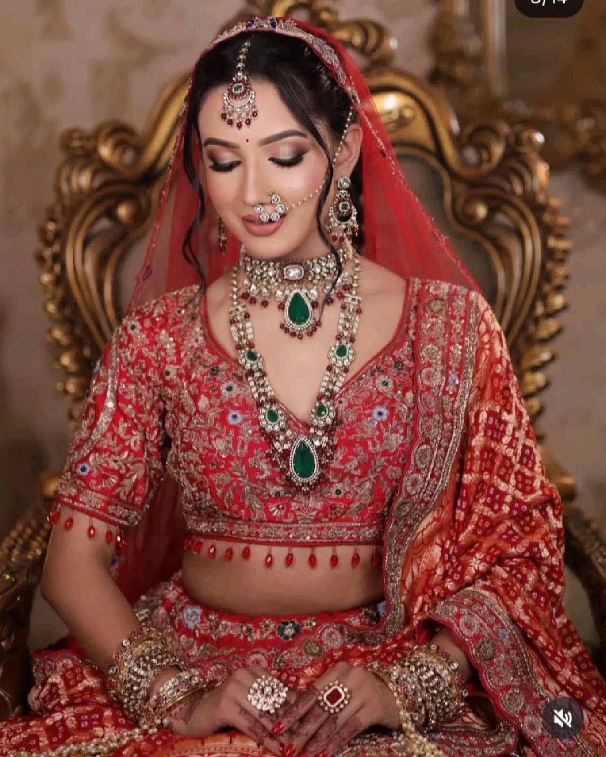 Gujarati bride in Dubai with coral and gold warm-toned bridal makeup look created by specialist Indian makeup artist Elani Artistry